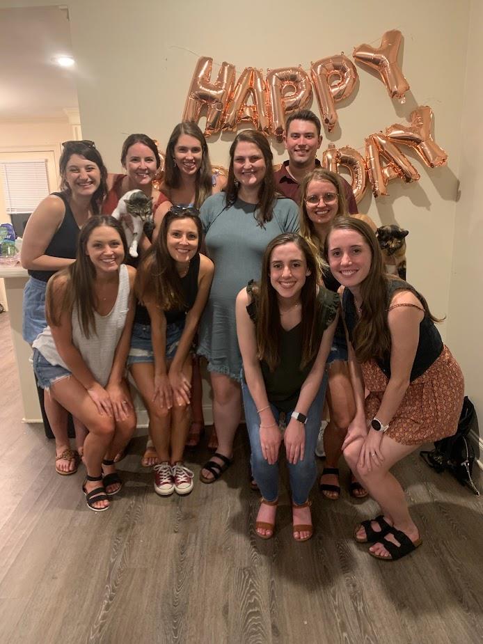 group picture of 10 pediatric residents at a birthday party